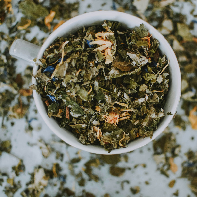 Loose-leaf herbal tea with dried flowers and herbs