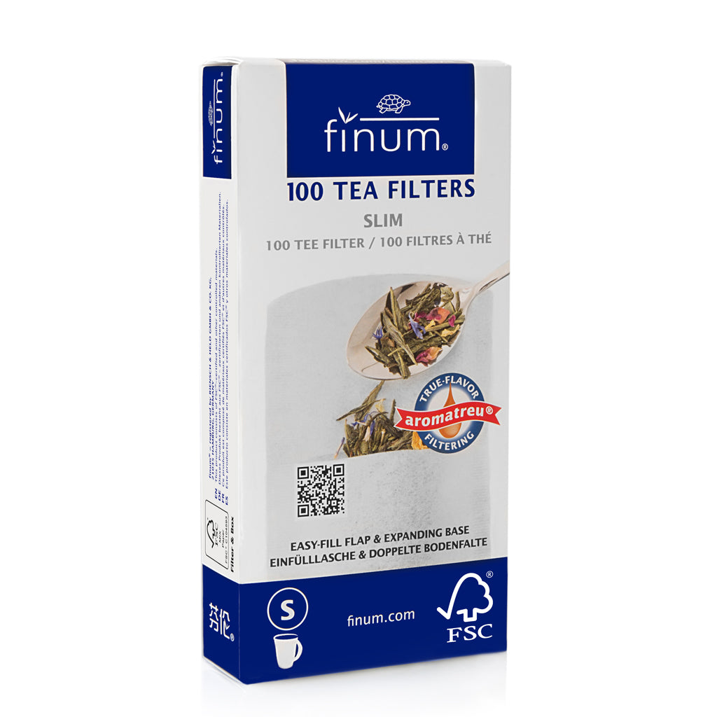 A box of Finum 100 slim tea filters. The packaging is predominantly blue and white, with an image of tea leaves and a spoon on the front.