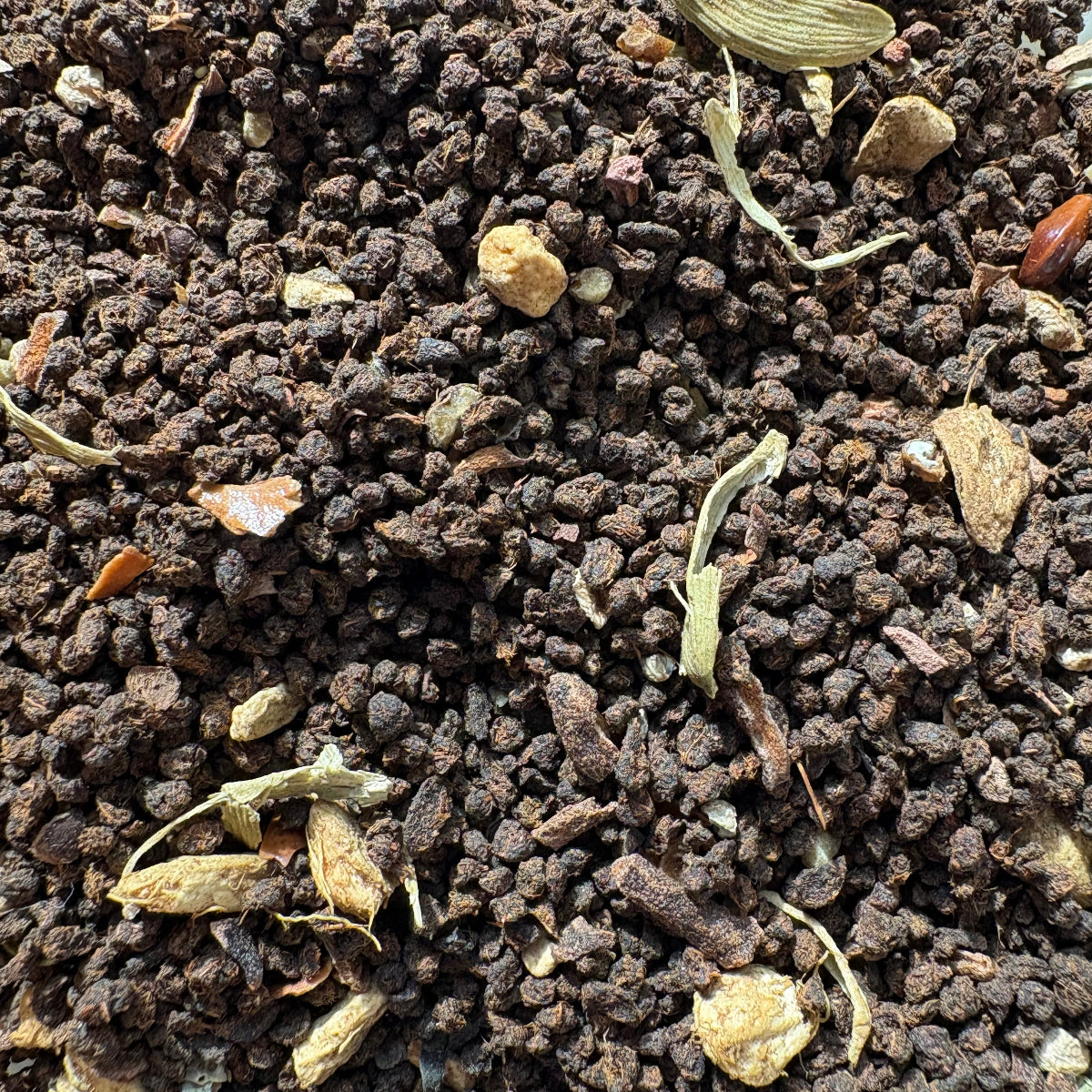 Organic Masala Chai loose-leaf tea blend with Assam black tea, cardamom, ginger, and traditional Indian spices.