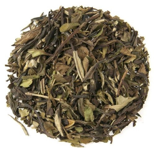 Teadaytea White Guava Glow premium loose-leaf white tea blend featuring delicate white tea leaves with dried guava pieces and subtle pomegranate accents.